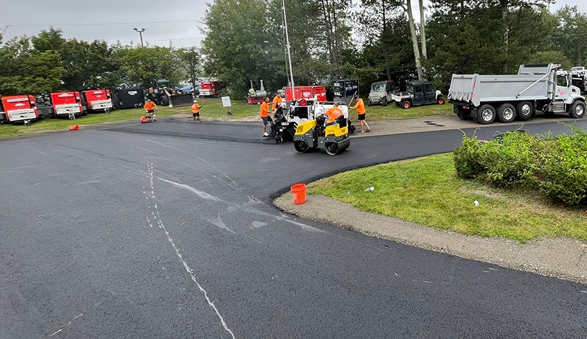 Company creating a driveway in Main